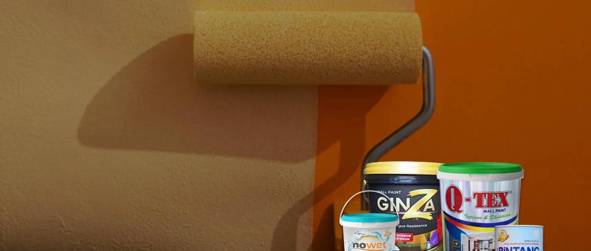 Roller painting a wall with Ichiban decorative paint