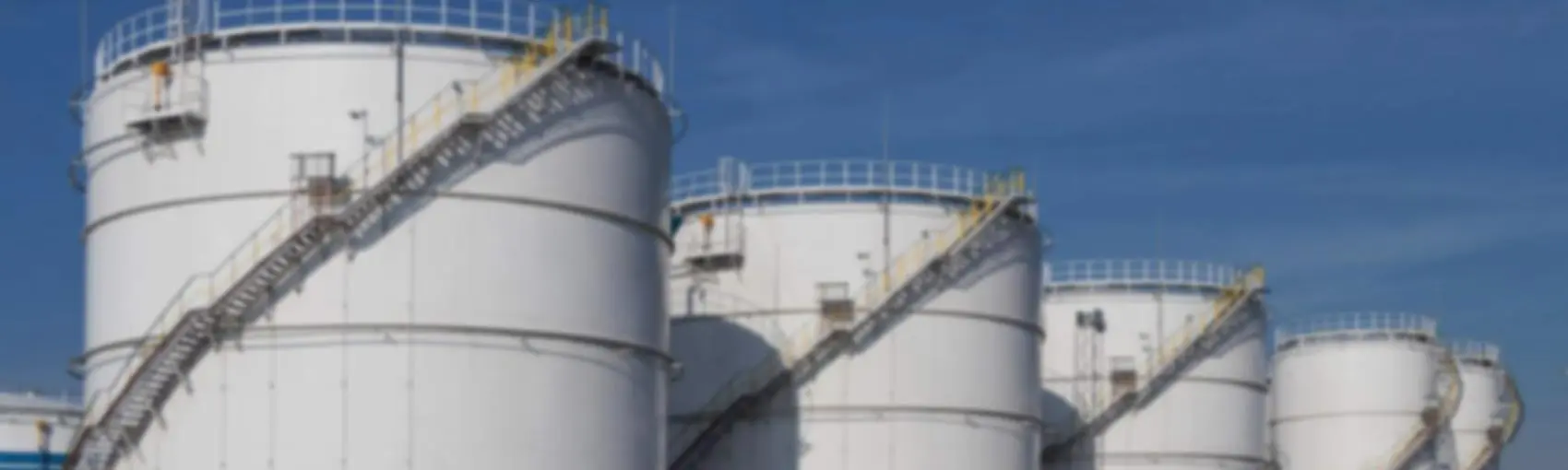 Industrial storage tanks with protective coating